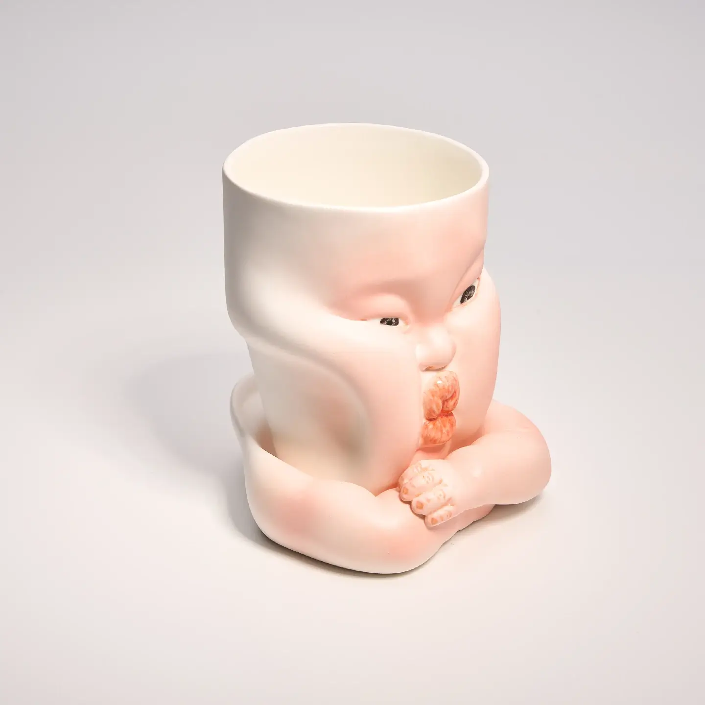 Whimsical Ceramic Cheeky Pinch Mug-Unique & Thoughtful Gifts for Meaningful Moments Whimsical Ceramic Cheeky Pinch Mug-this hand-painted mug features a chubby cheek being pinched in a gesture of affection