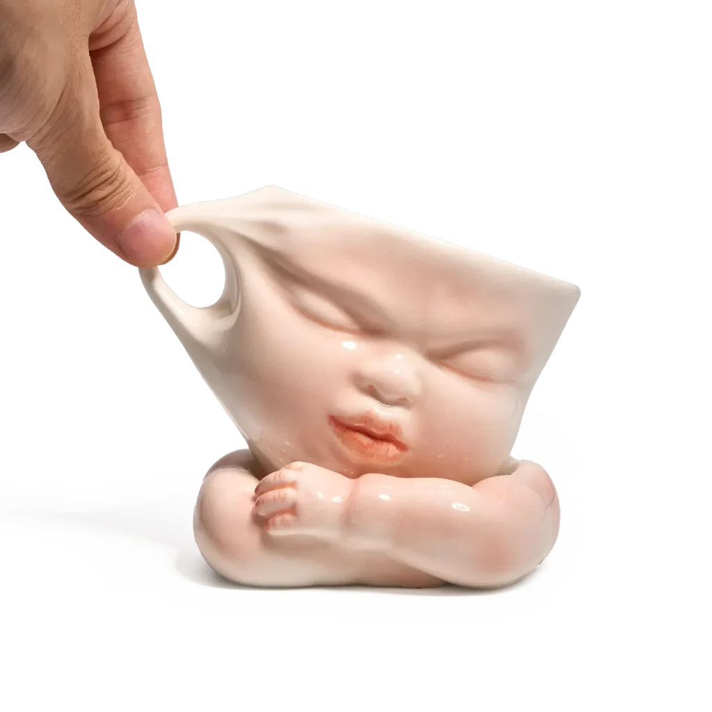 Whimsical Ceramic Cheeky Pull Mug-this hand-painted mug captures a playful moment with the mouth corner being pulled