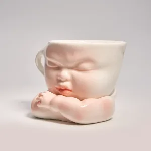 Whimsical Ceramic Cheeky Pull Mug-this hand-painted mug captures a playful moment with the mouth corner being pulled