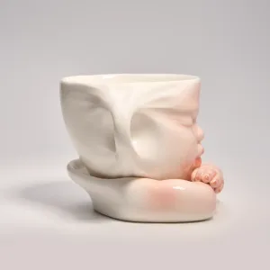 Whimsical Ceramic Cheeky Pull Mug-this hand-painted mug captures a playful moment with the mouth corner being pulled