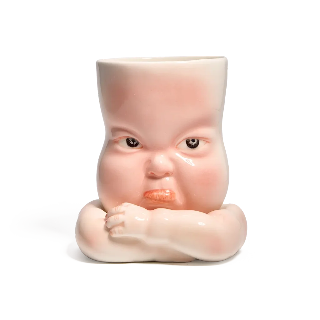 Whimsical Ceramic Pouty Mug-this hand-painted mug features a quirky pouting expression with twisted lips