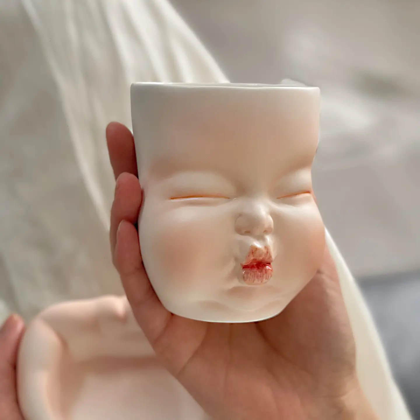 Whimsical Ceramic Smooch Mug-Unique & Thoughtful Gifts for Meaningful Moments Whimsical Ceramic Smooch Mug-this hand-painted mug features a cute puckered face ready for a shy kiss.