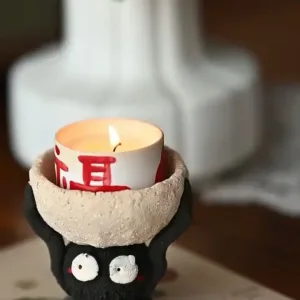 Ceramic Soot Sprite Candle Holder-Handcrafted from coarse pottery to capture the texture of a hardworking spirit.