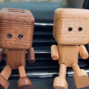 Shaking Wooden Man Car Vent Figurine-Powered by the breeze from your A/C and the rhythm of the road, this little wooden guy swings his legs in a happy, endless loop.