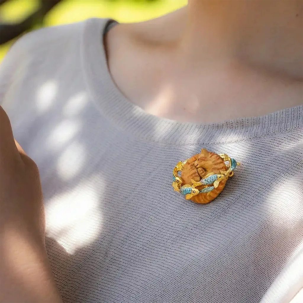 Saturn Cat`s Dream Brooch-This beautifully made brooch captures a blissful cat dreaming of fish.