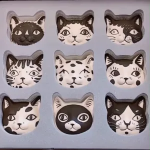 Cats Fridge Magnet-Transform your kitchen into a feline sanctuary with these nine hand-painted ceramic magnets.