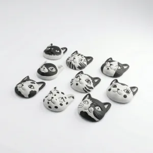 Cats Fridge Magnet-Transform your kitchen into a feline sanctuary with these nine hand-painted ceramic magnets.