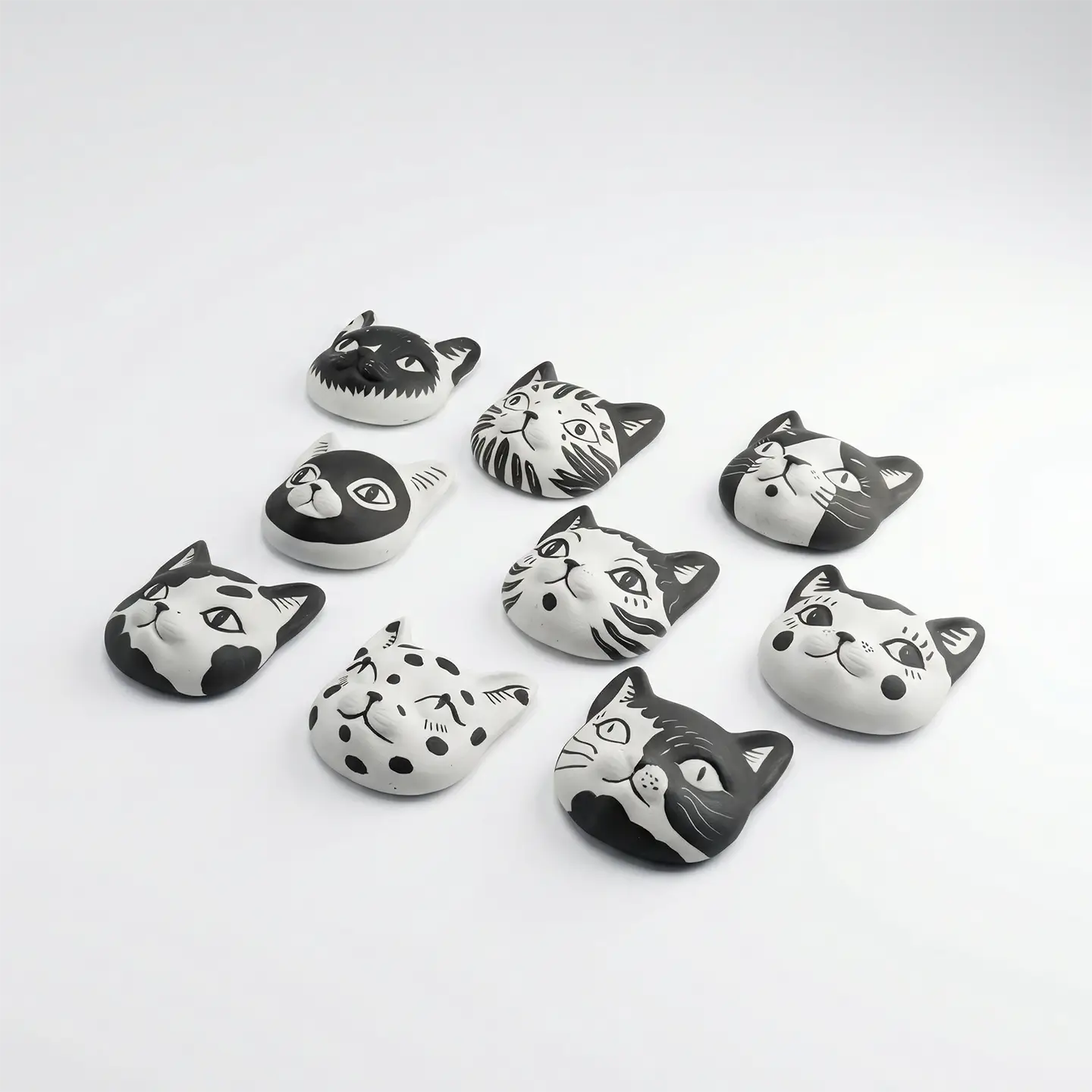 Cats Fridge Magnet-Unique & Thoughtful Gifts for Meaningful Moments Cats Fridge Magnet-Transform your kitchen into a feline sanctuary with these nine hand-painted ceramic magnets.